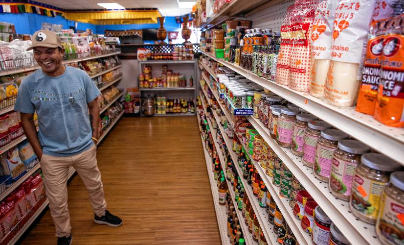 Karma Gonpo has the shelves stocked with items that customers will find familiar from their native countries at the Katmandu Bazaar Market on Loudon Road in Concord.