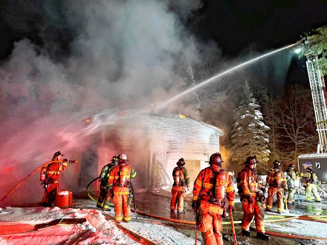 Concord firefighters worked to douse a garage fire at 69 Village Street in Penacook early Monday morning.