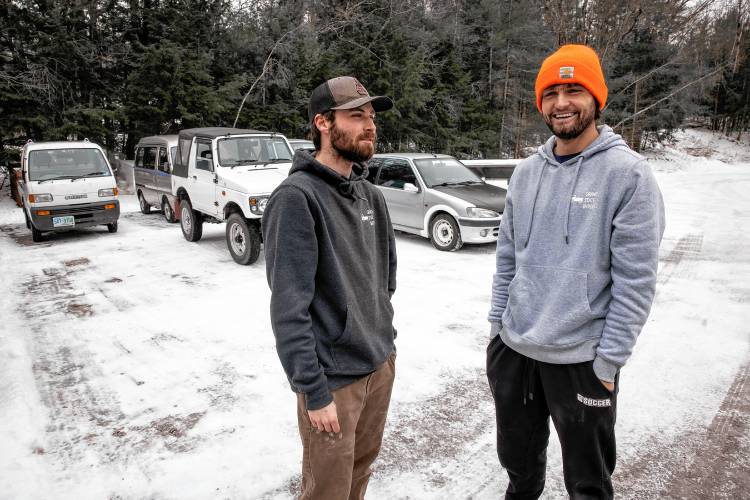 Granite State Imports co-owners Dylan Beckerman (left), and Stan Nelson at the lot for their kei vehicles in Hopkinton on Friday, January 31, 2025.