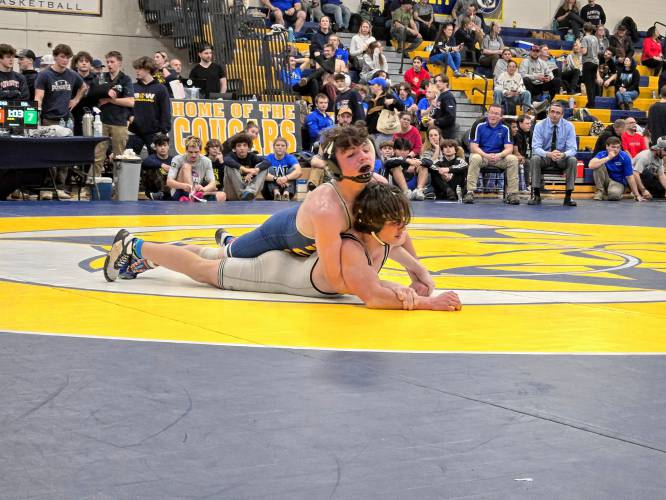 Bow’s Jake Todisco Coulon (top) wrestles Winnisquam’s Dylan Griffin in the 138-pound final at the Division III wrestling state championship at ConVal Regional High School on Saturday. Todisco Coulon won the 138 title to help the Falcons defend their team championship.