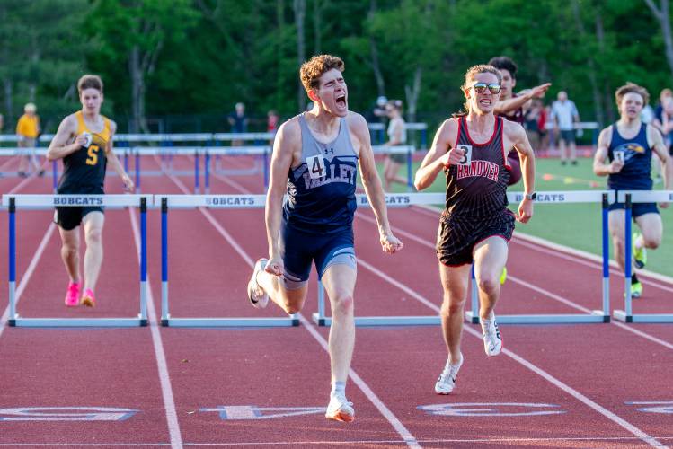 Merrimack Valley’s Mychal Reynolds (center) celebrates after crossing the finish line to claim the division title in the 300-meter hurdles at the NHIAA Division II championship on May 24 at Oyster River High School in Durham. Reynolds also finished third in the 110 hurdles.