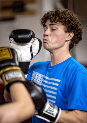Ritchie Philbrick fends off his brother Ronnieâs attempted punches during their boxing class at Averill's Boxing in downtown Concord on March 7, 2024.