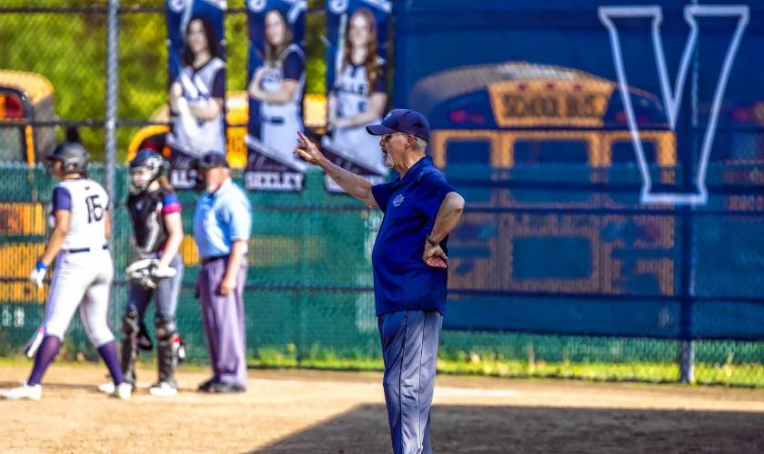 Merrimack Valley JV softball coach Tom Burke at third base in a game against John Stark earlier this month.
