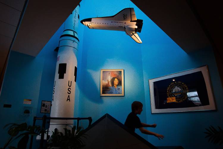 Edward Ainsworth, 10, of Sheldon, Vt., runs back to his grandmother and sister before settling into his planetarium seat to watch Christa McAuliffe: Reach for the Stars at the McAuliffe-Shepard Discovery Center on Saturday, Jan. 23, 2016. Edward Ainsworth, 10, of Sheldon, Vt., runs back to his grandmother and sister before settling into his planetarium seat to watch Christa McAuliffe: Reach for the Stars at the McAuliffe-Shepard Discovery Center on Saturday, Jan. 23, 2016.