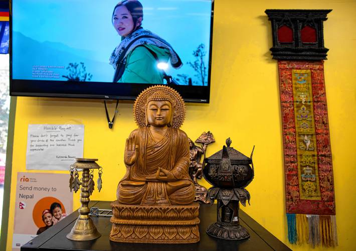 Karma Gonpo has the shelves stocked with items that customers will find familiar from their native countries at the Katmandu Bazaar Market on Loudon Road in Concord.