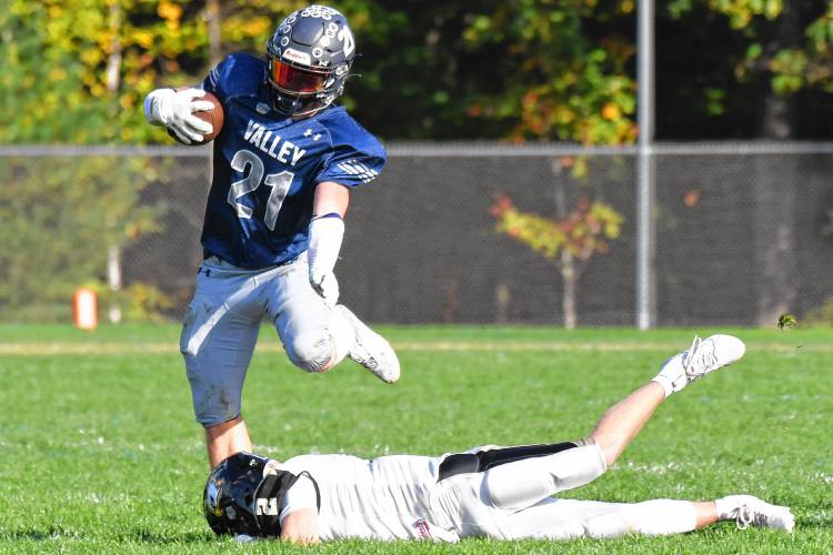 Merrimack Valley running back Reece Clermont (21) breaks a tackle during MV’s homecoming football game against Kennett on Saturday. Clermont scored four touchdowns to lead the Pride to a 28-7 victory.