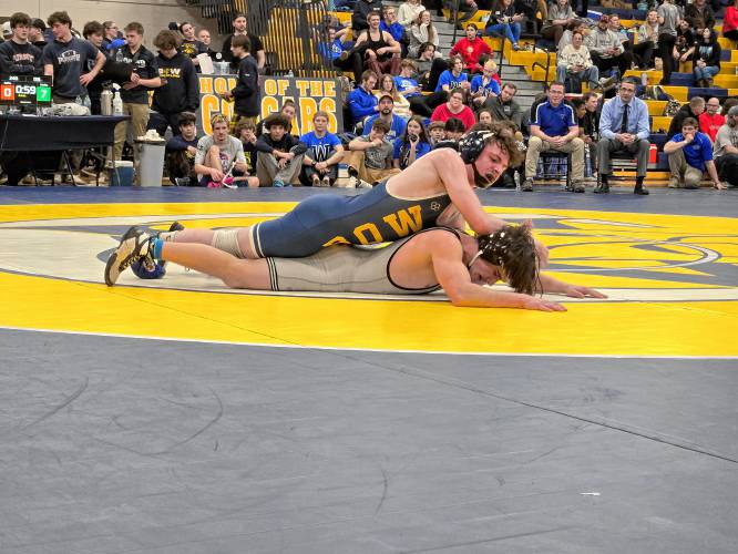 Bow’s Jake Todisco Coulon (top) wrestles Winnisquam’s Dylan Griffin in the 138-pound final at the Division III wrestling state championship at ConVal Regional High School on Saturday. Todisco Coulon won the 138 title to help the Falcons defend their team championship.