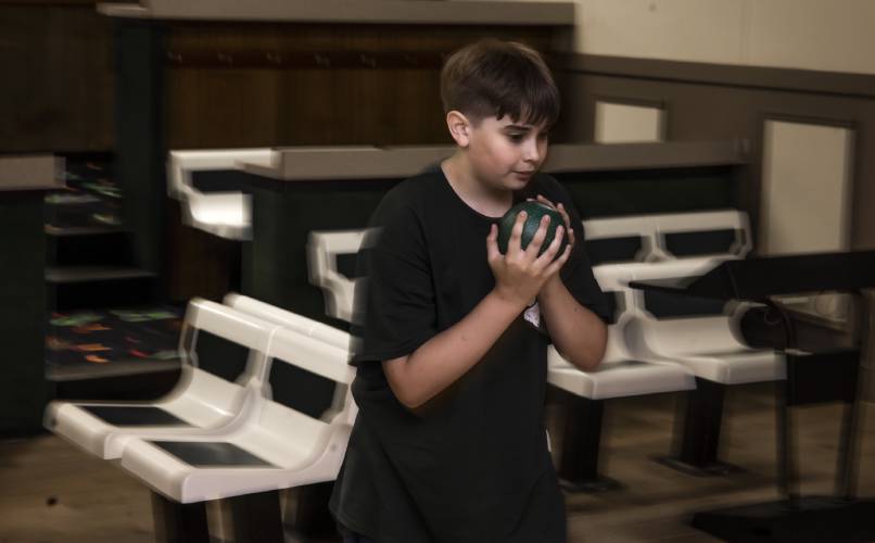 Patrick Douglas-Conlon, 11, gets ready to bowl at Boutwell’s on Friday, June 20, 2025. Twenty-four teams from the Northeast and Canada will be coming to Boutwell’s Bowling Center in Concord this weekend.