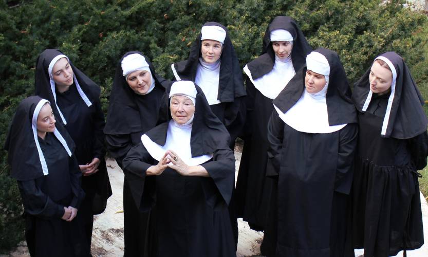 The good nuns of the Abbey trying to figure out “How to Solve a Problem Like Maria” as they gather around the Mother Abbess played by Dorothy Yanish.  From Left to Right: Rae Easter, Maddie Short, Natalie Locke, Hannah McCauley, Deidre Arcand, Lauren Matava and Katherine Demers. 