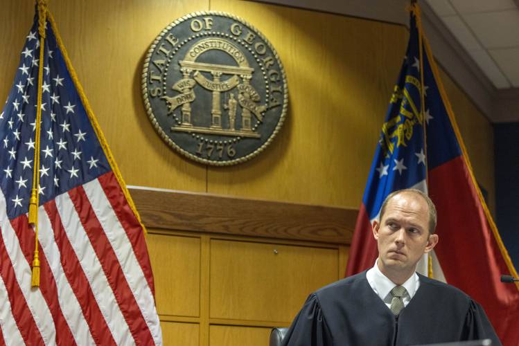 Fulton County Superior Judge Scott McAfee listens to Fulton County Special Executive District Attorney Daysha Young as she reads the plea agreement to defendant Kenneth Chesebro during an October 2023 hearing at the Fulton County Courthouse in Atlanta.