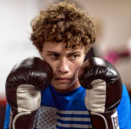 Ritchie Philbrick fends off his brother Ronnieâs attempted punches during their boxing class at Averill's Boxing in downtown Concord on March 7, 2024.