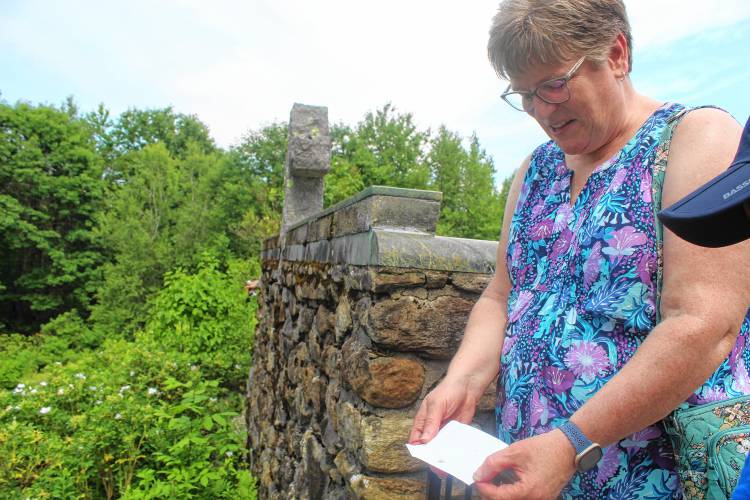 Laura Paul releases a Monarch butterfly at Cathedral of the Pines in honor of her late mother.