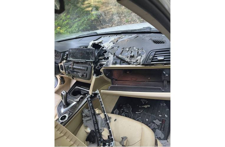 This July 15, 2024, photo shows the damage caused by a bear and cub that broke into a car, and became trapped inside in Winsted, CT, until freed by state environmental conservation police. It turned out to be the first of three episodes involving bears in Connecticut over six days that were publicly reported by the state Department of Energy and Environmental Protection — another sign of the increasing black bear population in the state. (AP Photo)