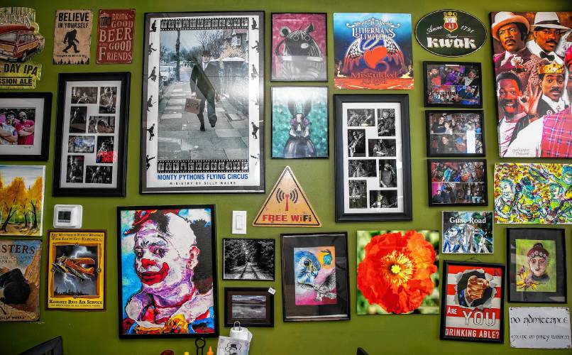 The walls of the Forum Pub are filled an variety of posters, paintings and photographs.