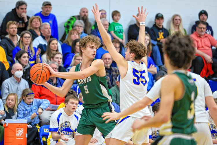 Ajay Tremblay (55) defends Hopkinton’s Abram Standefer during Friday’s D-III quarterfinal at Kearsarge Regional High School.