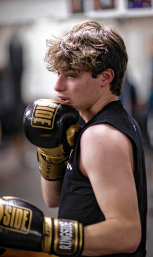 Ronny Philbrick warms up for his boxing class at Averill's Boxing in downtown Concord on March 7, 2024. Philbrick is hoping to box in the future and takes the class with his brother, Ritchie.