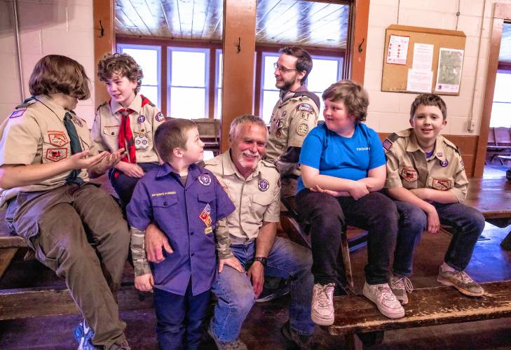Stephen Donahue, center, and the entire Boy Scout Troop 61 have a meeting at the Veterans Memorial Ski Area in Franklin. From left are Scout members Jaxon Desmarais, Lucas Knight, Brantley Donahue, Stephen Donahue,  leader Maxwell Maynard, Jacob Drew and James Machos.