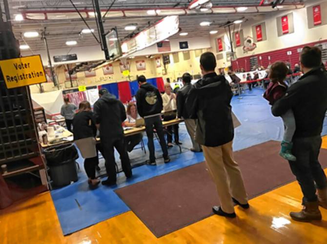 People line up to register to vote in Bedford. People line up to register to vote in Bedford.