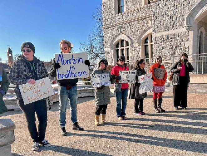 Dozens of protestors gathered outside the Legislative Office Building in Concord to oppose a proposed 15-week abortion ban.