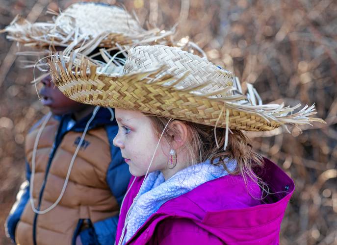 Charlotte Hall wears a straw hat in order to attrach the birds at White Farm at the Project SEE on Thursday, December 14, 2023. At White Farm, education goes beyond the confines of traditional classrooms. The program’s standout feature is its immersive, hands-on approach.