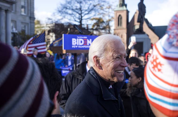 Then Former Vice President Joe Biden greets rally participants at the State House during his rally after signing up for the New Hampshire Primary at the Secretary of State off on Friday, November 8, 2019.
