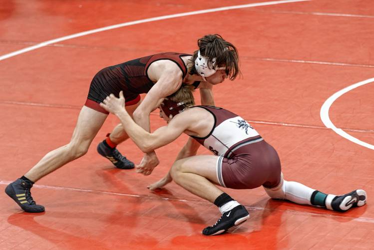 Concord’s  Cullen Burke (left) wrestles Noble, Maine’s Owen Gray during the 120-pound title bout at the Minickiello wrestling tournament at Keene High School on Saturday. Burke won a 9-6 decision to claim the title. Concord topped the 27-team field.