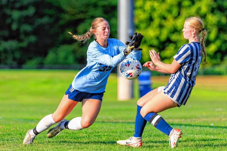 Bow goalkeeper Gwen Barrieau (left) makes a save while Merrimack Valley’s Sydney Bailey goes after the ball during a game at MV on Thursday.