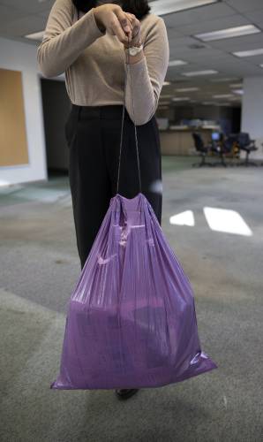 The purple trash bag did hold up from the string on the 20-pound test.