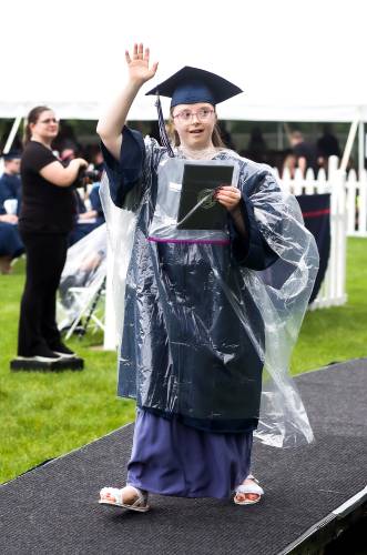 Merrimack Valley graduate Lexi Ann Goley waves to her family after receiving her diploma at the ceremony on Saturday, June 7, 2025.