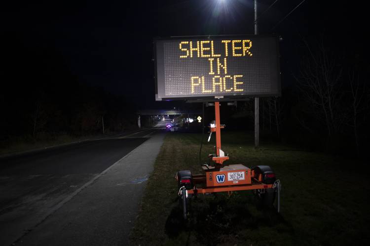 A sign signals the public to shelter in place during an active shooter situation on Wednesday, Oct. 25, 2023, in Lewiston, Maine. (Derek Davis/Portland Press Herald via AP)