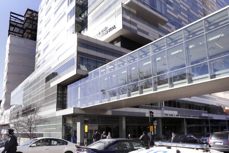 FILE - Pedestrians walk past the Shapiro Building at Brigham and Women's Hospital, Jan. 20, 2015, in Boston. Some women who spent months preparing for in vitro fertilization procedures have been left devastated after flooding from a burst water main at the hospital on Christmas Eve, Sunday, Dec. 24, 2023, disrupted services for about 200 IVF patients. (AP Photo/Steven Senne, File) FILE - Pedestrians walk past the Shapiro Building at Brigham and Women's Hospital, Jan. 20, 2015, in Boston. Some women who spent months preparing for in vitro fertilization procedures have been left devastated after flooding from a burst water main at the hospital on Christmas Eve, Sunday, Dec. 24, 2023, disrupted services for about 200 IVF patients. (AP Photo/Steven Senne, File)