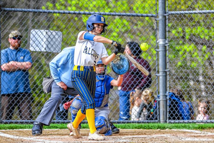 Senior Ella Roos makes contact with a pitch in Bow’s 9-0 win over Pelham on Friday. Roos finished the day 2-for-3 at the plate.