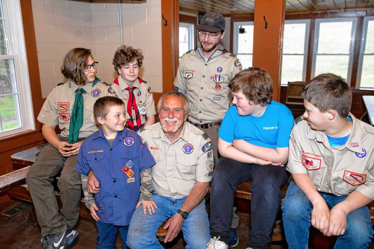 Stephen Donahue (center) and the entire Boy Scout Troop 61 have a meeting at the Veterans Memorial Ski Area in Franklin on Wednesday night, May 8, 2024. Scout members Jaxon Desmarais (left), Lucas Knight, Brantley Donahue, Donahue,  leader Maxwell Maynard, Jacob Drew, and James Machos.