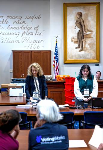 Senior Deputy Secretary of State Patricia Lovejoy (left), along with Assistant Secretary of Stare Jennifer Cote prepare the ballots from Winchester to be fed into the high speed scanner at the State Archives in Concord on Wednesday, September 11, 2024.
