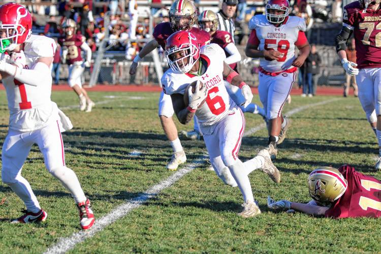 Concord running back Tim Fahnbulleh (6) runs with the ball for a gain during the Tide's Division I preliminary round game at Alvirne in Hudson on Saturday. Fahnbulleh ran for 124 yards, including a 32-yard touchdown, but No. 9 Concord fell to No. 8 Alvirne, 33-10.