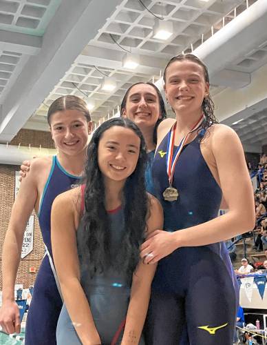 From left, Bow’s Ava Popielarz, Emily Hou, Sabine Karanouh and Lena Thompson pose with their medals after finishing fourth in the 200 freestyle relay at Friday’s state meet. The same four swimmers also formed Bow's third-place 200 medley, helping lift the Falcons to fourth place.