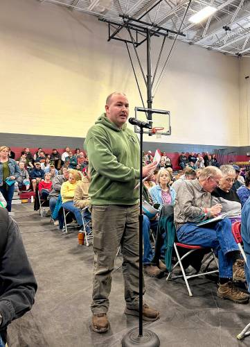 Shaun Kitson proposed two amendments at Loudon’s town meeting, which cut the town’s savings deposits for this coming year by $306,000.