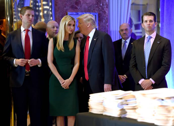 In this file photo from Jan. 11, 2017, U.S. President-elect Donald Trump along with his children Eric, left, Ivanka and Donald Jr. arrive for a news conference at Trump Tower in New York.