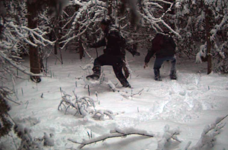 In this surveillance image provided by the United States Border Patrol Swanton sector, two individuals illegally cross the US/Canada border during January 2023 in the Vermont, New Hampshire and New York enforcement sector. Law enforcement officials say a Mexican immigrant who just entered the United States illegally from Canada collapsed and died on Sunday, Feb. 19, 2023, after being confronted by Border Patrol agents on a remote section of the U.S.-Canadian border in northern...