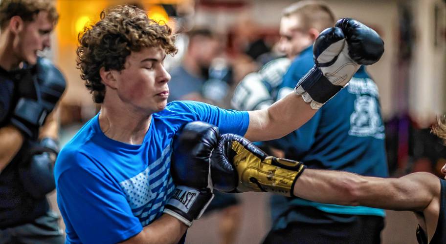 Ritchie Philbrick fends off his brother Ronnieâs punch attempts during their boxing class at Averill's Boxing in downtown Concord on March 7, 2024. They never land an actual punch during the class.