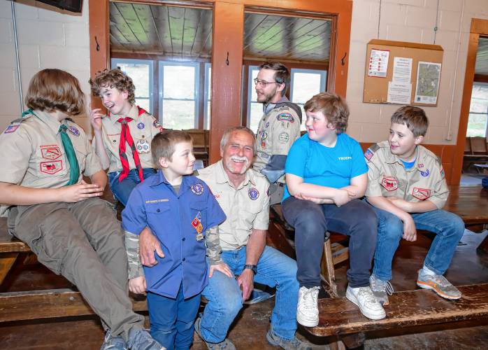Stephen Donahue (center) and the entire Boy Scout Troop 61 have a meeting at the Veterans Memorial Ski Area in Franklin on Wednesday night, May 8, 2024. Scout members Jaxon Desmarais (left), Lucas Knight, Brantley Donahue, Donahue, leader Maxwell Maynard, Jacob Drew, and James Machos.