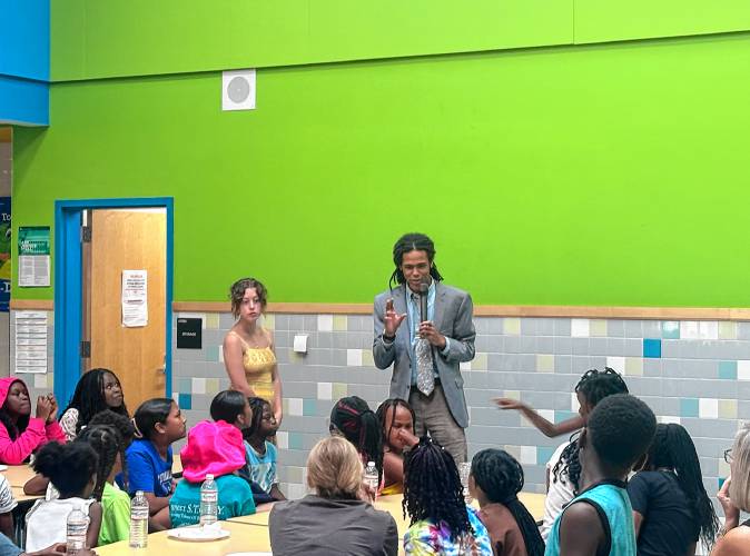 State Representative Jonah Wheeler addresses children on Juneteenth.