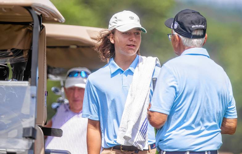 Concord’s own Bob Mielcarz (right) gets ready to tee off at the New Hampshire State Am with his grandson, Wes Geiselman serving as his caddy on what could be his last round at the statewide tournament on Tuesday, July 9, 2024.
