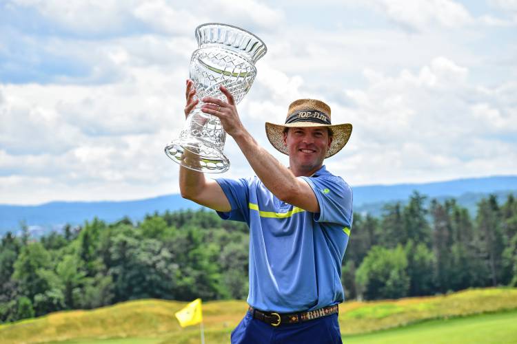 New London’s Rob Henley of Lake Sunapee Country Club hoists the championship trophy after claiming the 121st New Hampshire State Amateur Championship title on Saturday at Concord Country Club. Henley won his first state am title after narrowly losing in last year's final.