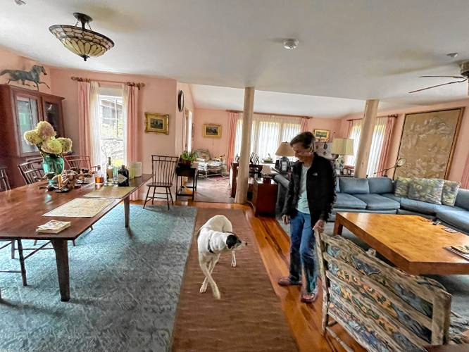 Sue Chollet and Rosie in her living room. 