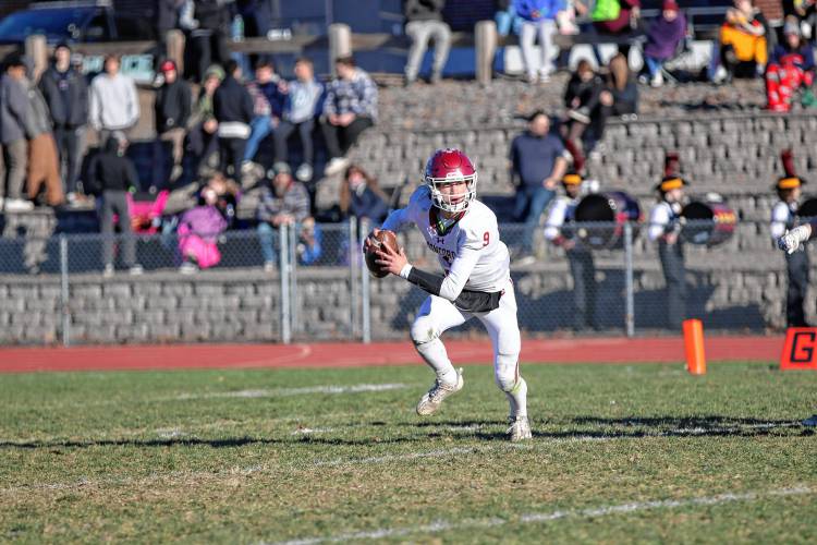 Concord quarterback Colby Nyhan looks for a teammate downfield during the Crimson Tide's Division I preliminary round game at Alvirne in Hudson on Saturday. Nyhan threw for 48 yards and connected on a 34-yard field goal, but No. 9 Concord fell to No. 8 Alvirne, 33-10.