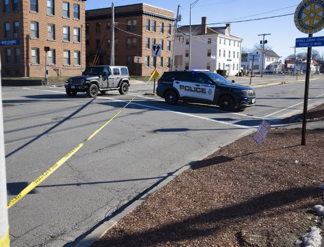 A Concord police cruiser blocks the southbound lanes of North Main Street after a woman on a motorized wheelchair was struck by a vehicle near the intersection with Franklin Street on Saturday morning, December 14, 2024. The lanes were shut down for hours while invesigators re-created the accident.