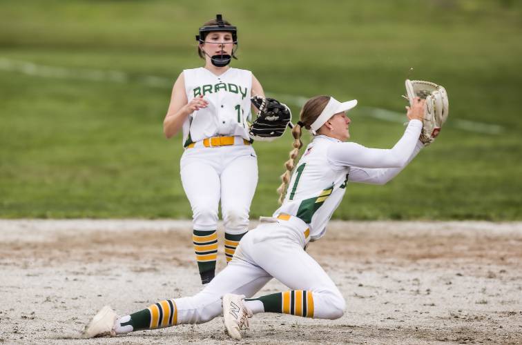 Bishop Brady shortstop Payton Bryson makes a diving catch against Monadnock on Monday as second baseman Reese Henry looks on.