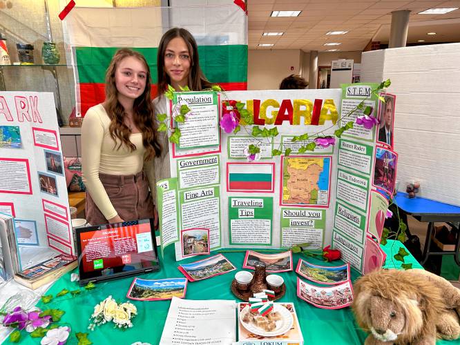 Sophomores Melinda Becirovic and Phoebe Abdulah share facts about Bulgaria on Friday at the World Fair at Bow High School. 