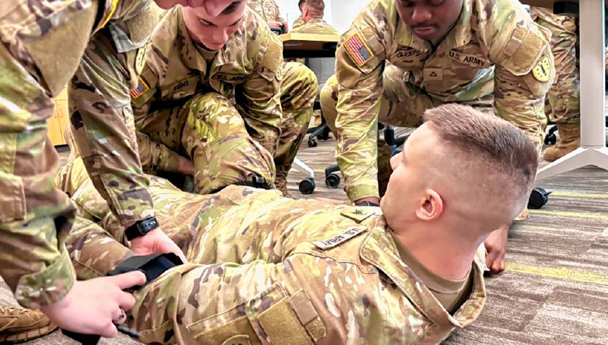 Sgt. Connor Decker plays the role of an injured soldier during training with Pfc. Macenzi Connors, Spc. Jared Toms, and Pfc. Nendoe Gleekia for their mission at the Texas border. Sgt. Connor Decker plays the role of an injured soldier during training with Pfc. Macenzi Connors, Spc. Jared Toms, and Pfc. Nendoe Gleekia for their mission at the Texas border.
